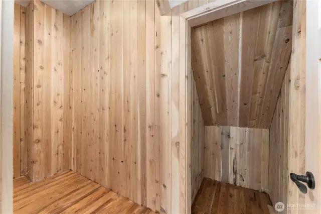 Primary bedroom walk in closet with cedar walls