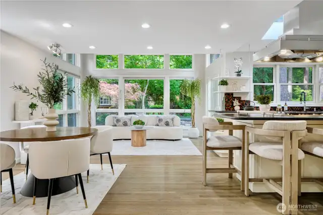 Modern and elegant interior featuring a living area, dining space, and kitchen