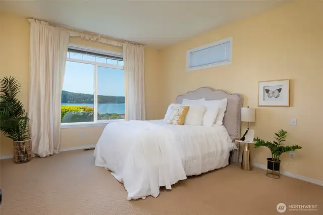 Gracious primary suite with sparkling water views!