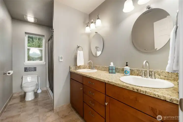 Large upstairs bathroom with double sinks.