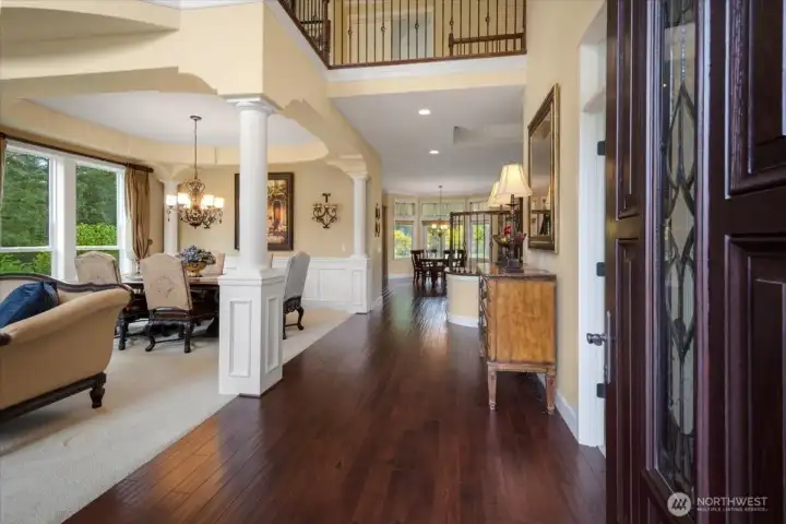 Gleaming hardwoods, formal living & dining defined by architectural pillars