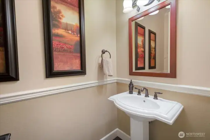 First floor powder room conveniently located close to garage too.