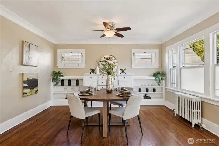 Dining area with built-ins off the living room area.  Natural light floods this space!