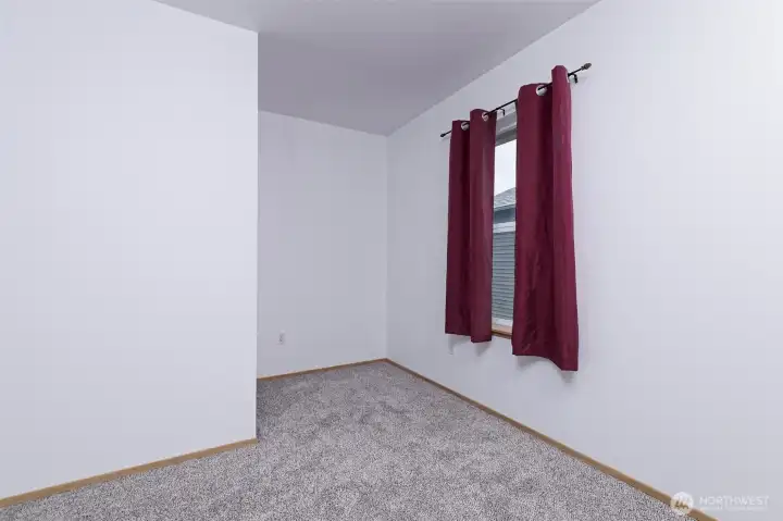 Primary bedroom. Room for dresser or desk.