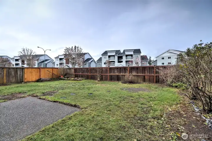 Fenced back yard with patio