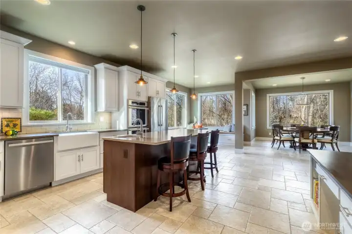 Tile flooring throughout kitchen, dining and living room