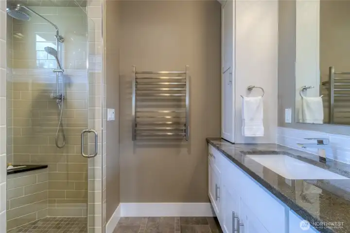 Fully tiled bathroom with double vanity