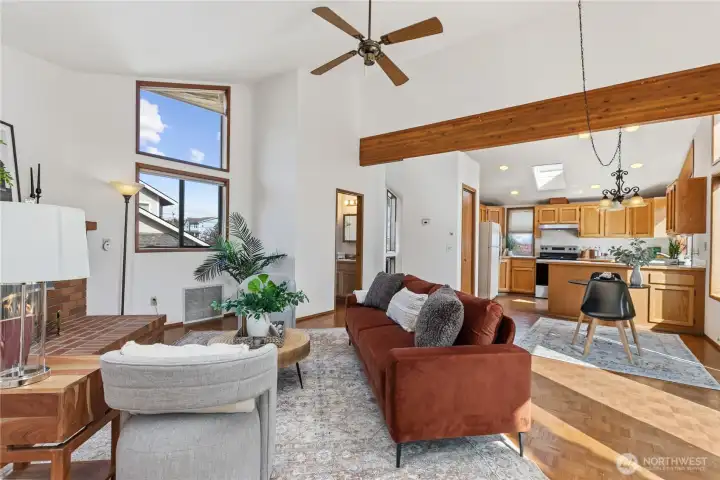 Vaulted ceilings and wood beam details elevate the main floor living areas.