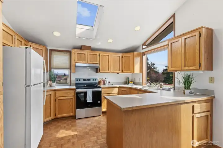 Functionally designed kitchen has tons of natural light and charm.