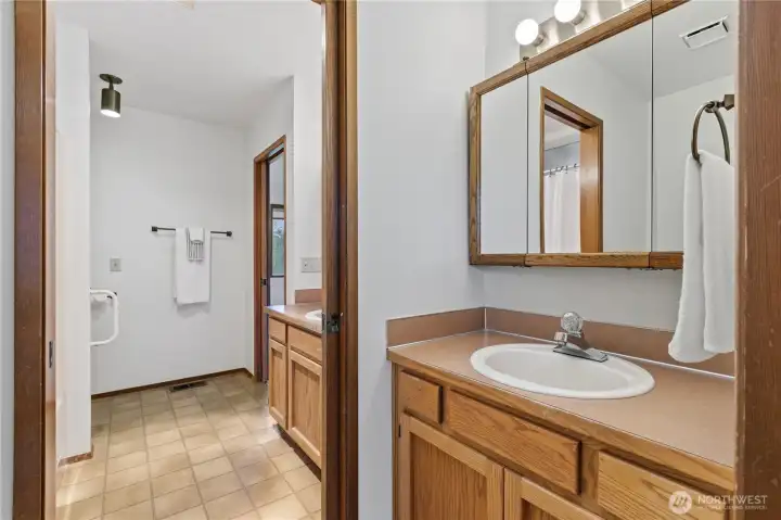 Jack and Jill bathroom is a full bath AND a half bath and connects the two bedrooms for efficient privacy.