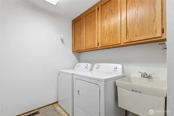 Designated utility and laundry room conveniently located near the bedrooms