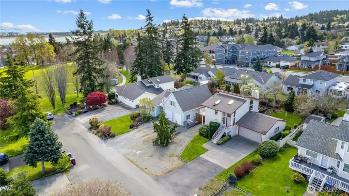 Aerial view highlighting proximity to nearby park, water, and surrounding neighborhood amenities.
