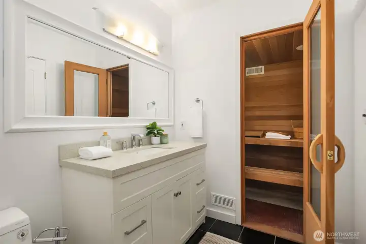 Bathroom with sauna in basement.