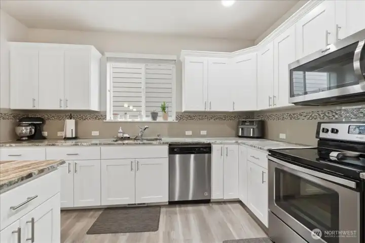 Cabinets and counter space for multiple cooks in this spacious kitchen