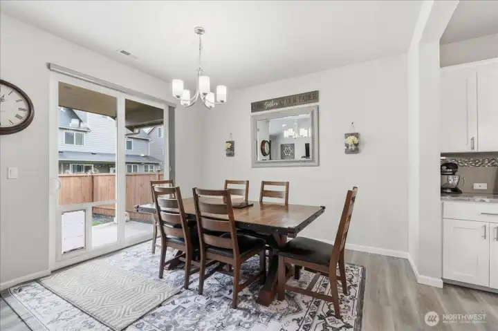 Dining area opens to back yard patio.