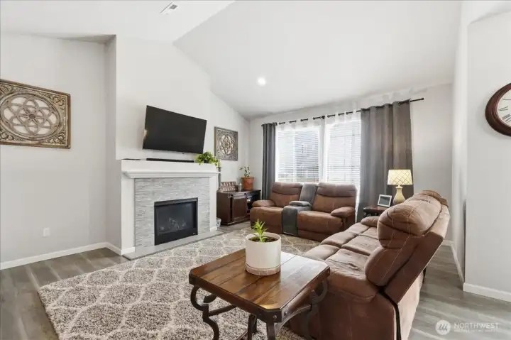 Relax before the fireplace and watch your favorite show.