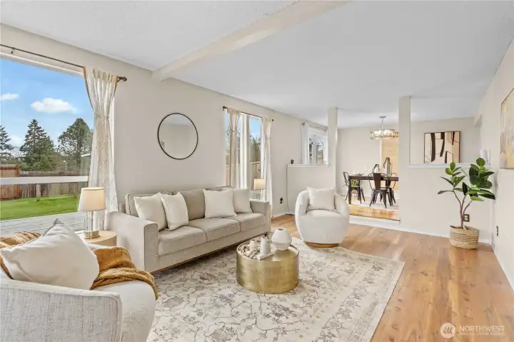living room on left with large windows to capture every view.