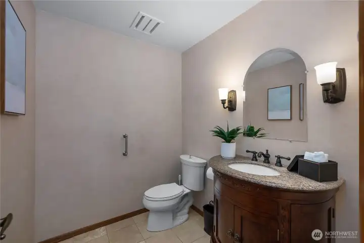 Stylish guest bath tucked conveniently near the main living spaces.