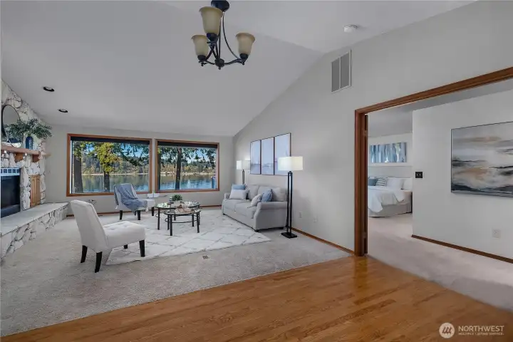 Seamless flow from living area to the main-level primary suite, all with water views nearby.