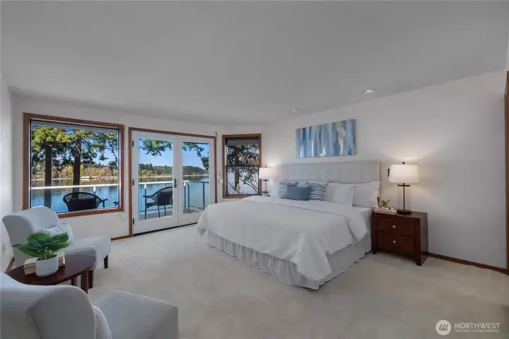Wake up to tranquil waterfront scenery from this generous primary retreat.