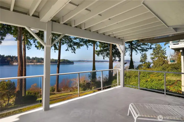 Lower Deck off FR offers a covered outdoor living area extends the home’s year-round enjoyment of the view.