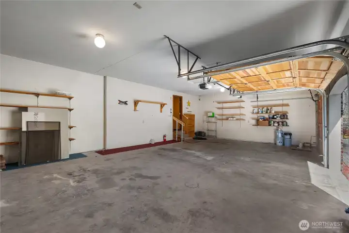 Generous triple garage space accommodates vehicles, tools, and extra storage needs.