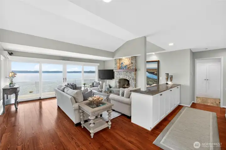 The great room invites the outdoors in with a huge 4-panel glass door system.