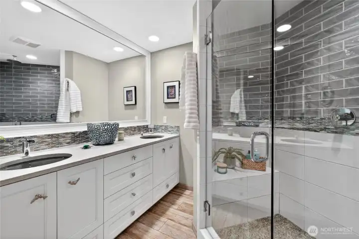 and the primary bathroom is pure indulgence with craftsman quality finishes.