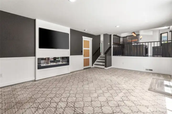 Cozy family room with electric frpl and slider to patio
