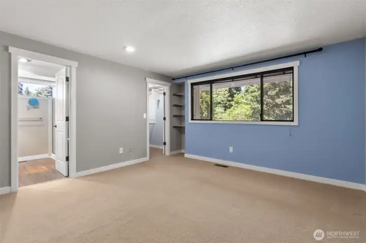 Primary bedroom with an abundance of light