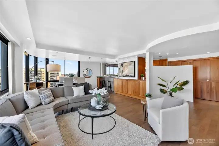 Open concept living room with wall of windows.