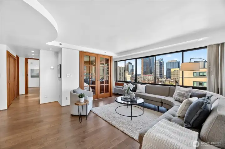 Living room facing west with ample sun and beautiful city skyline views.