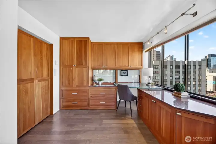 Murphy bed disappears when work calls and office is needed.