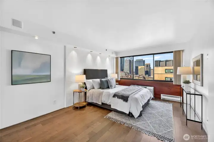 Primary bedroom with beautiful westerly city views, wood flooring and fresh paint throughout.