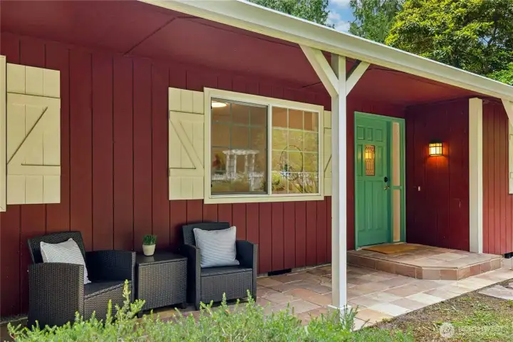 The wide, covered patio offers shade from the western sun and a place to come in out of the rain. The wide, covered patio offers shade from the western sun and a place to come in out of the rain.