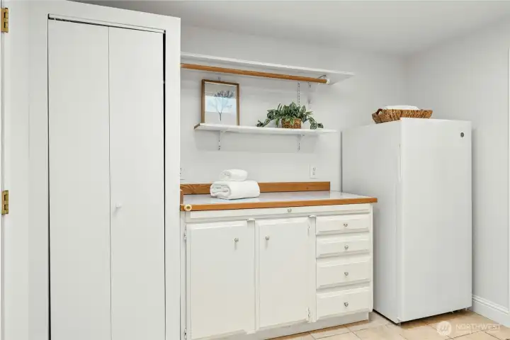 The spacious laundry room/mudroom includes plenty of built-in storage. The spacious laundry room/mudroom includes plenty of built-in storage.