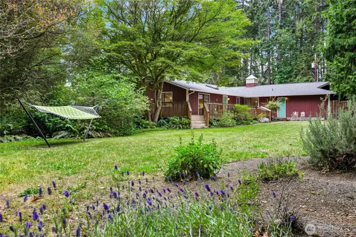 Multiple garden spaces and mature trees creates privacy and inviting spaces to unwind. Multiple garden spaces and mature trees creates privacy and inviting spaces to unwind.