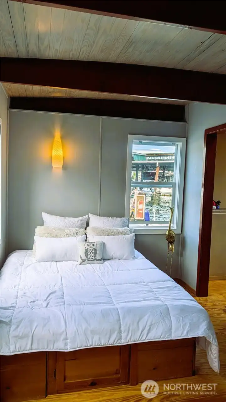 Queen bed with built-in storage below Queen bed with built-in storage below