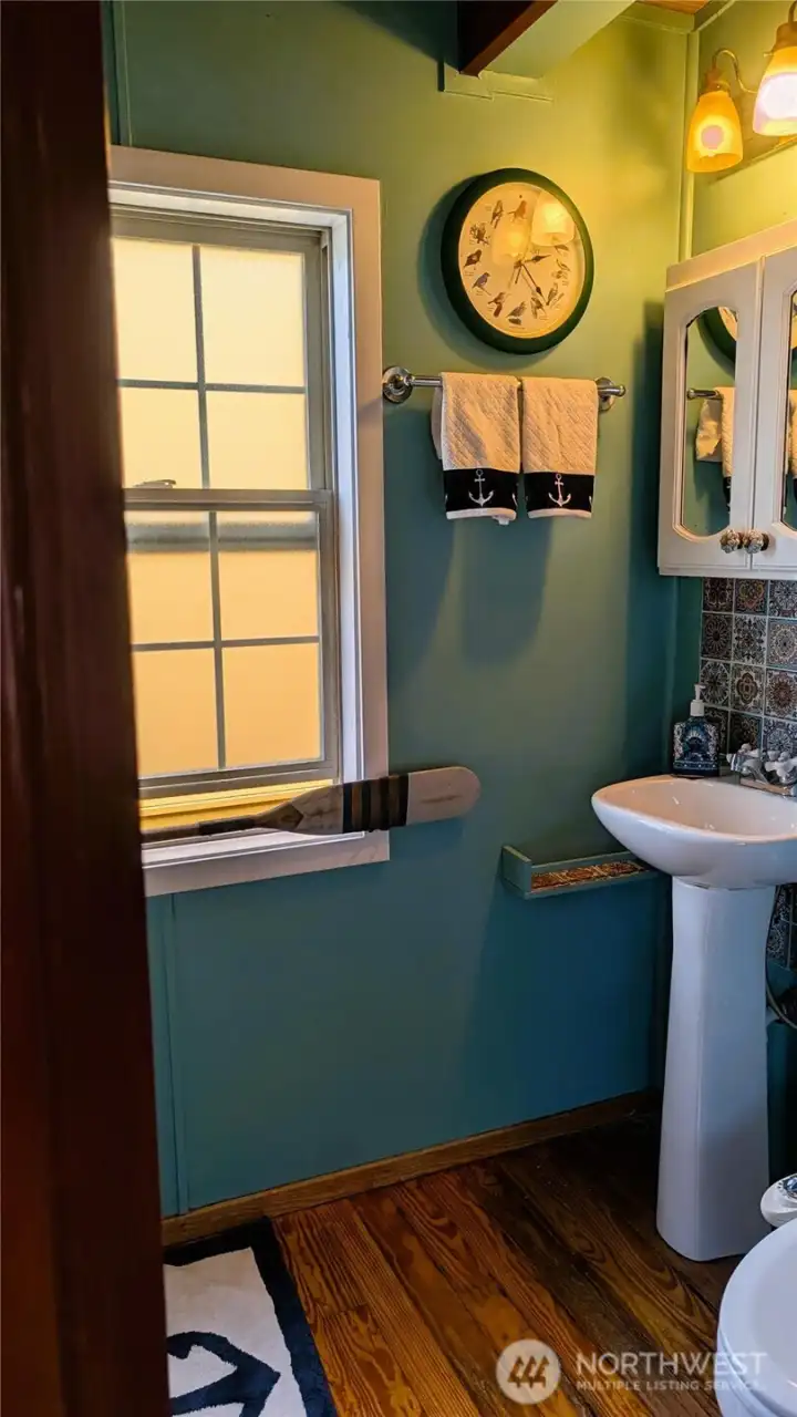 Entry to full bathroom. pedestal sink Entry to full bathroom. pedestal sink