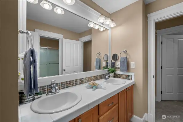 The Jack and Jill bathroom features convenient access from two separate bedrooms, offering practicality and comfort for daily use between 2nd and 3rd bedrooms.