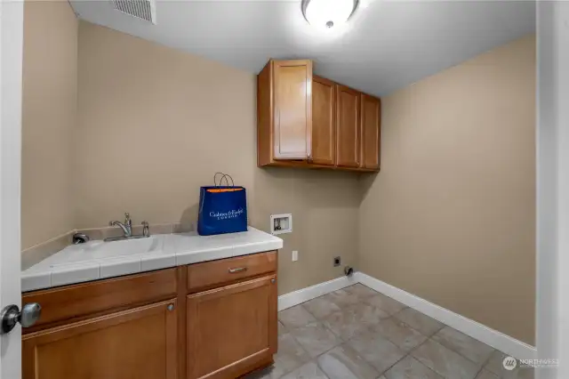 The utility room on the second floor provides easy access for laundry needs, conveniently located near all the bedrooms.