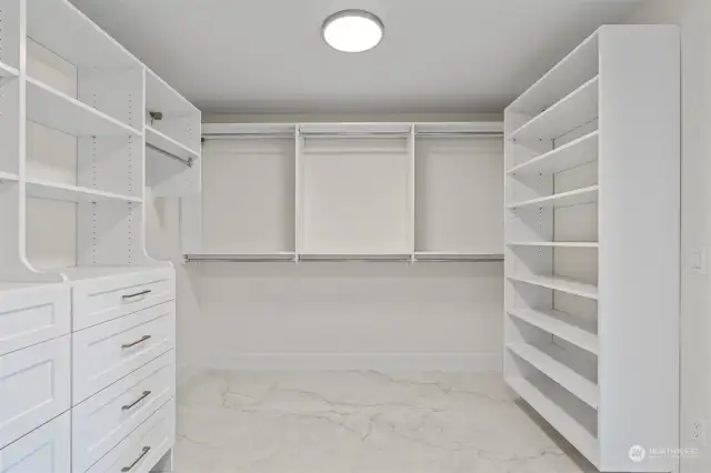 Primary bedroom walk in closet