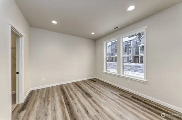 Main level bedroom with large walk-in closet.