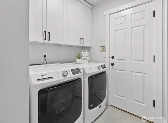 Main floor laundry room with brand new Maytag Washer & Dryer