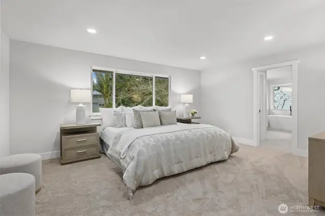 The refreshed primary bedroom is a show stopper! Featuring brand new flooring, lighting, trim and a brand new remodeled en-suite bathroom with walk-in closet.