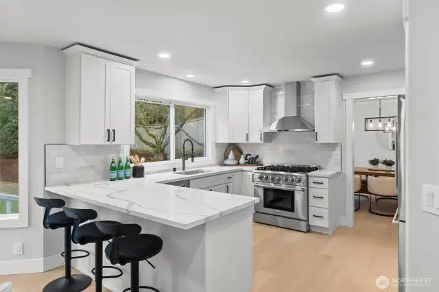 The redesigned luxury kitched features a 36" Thor gas range and hood, new full height cabinets, new quartz counters & backsplash along with a new Bosch refrigerator, Bosch dishwasher and Bosch wall oven & microwave