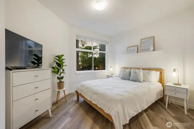 A spacious bedroom with a walk-in closet provides the perfect place to unwind.