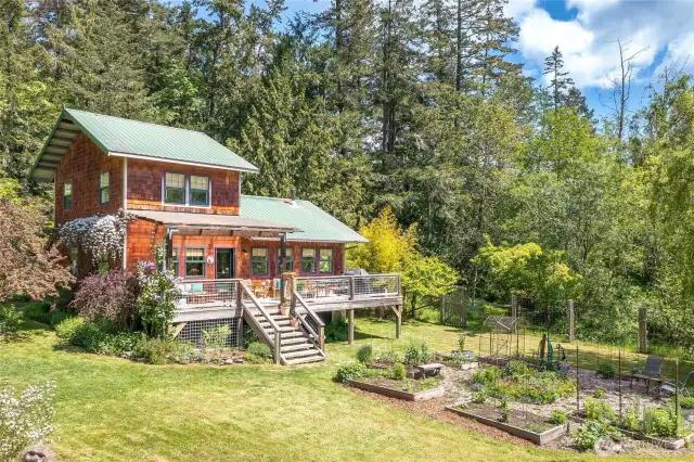 The 3 bedroom 1 bath retreat is nestled above 5.2 acres.