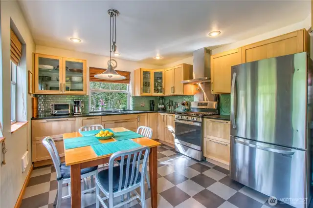 Newer appliances and Marmoleum flooring create a worry free kitchen.