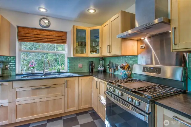 The propane range is a chef's delight and the tile backsplash brings color and happiness to the space.